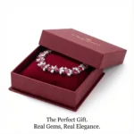 This is a light luxury 925 silver bracelet with synthetic rubies as the central stone