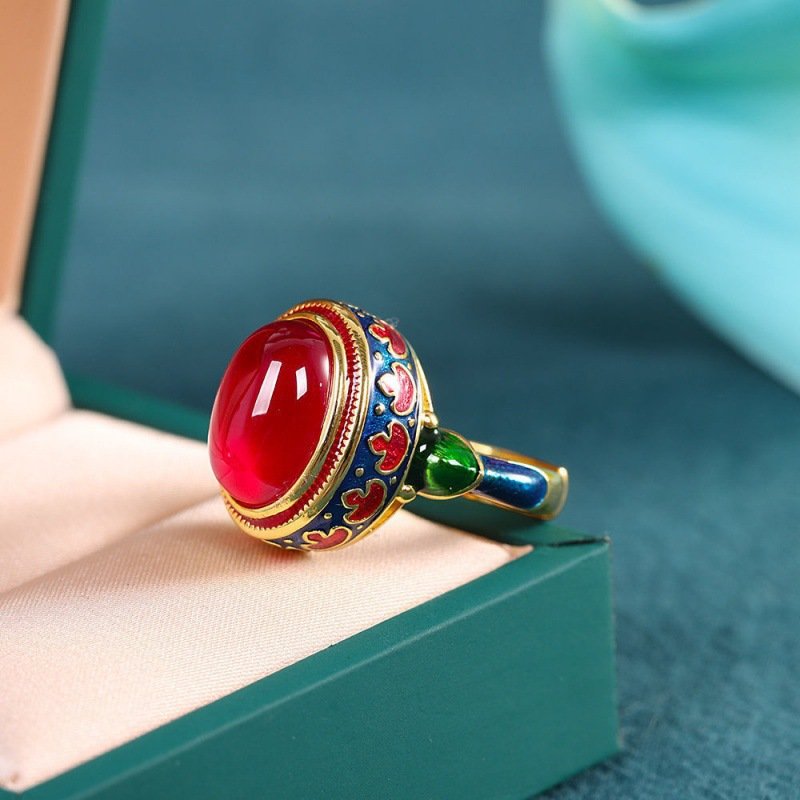 Adjustable ring featuring gold-sand plating, stone inlay, and enamel detailing.